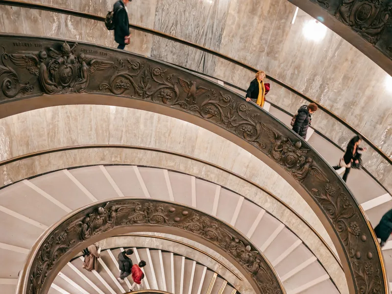 Interior gallery of the Vatican Museums leading toward the Sistine Chapel