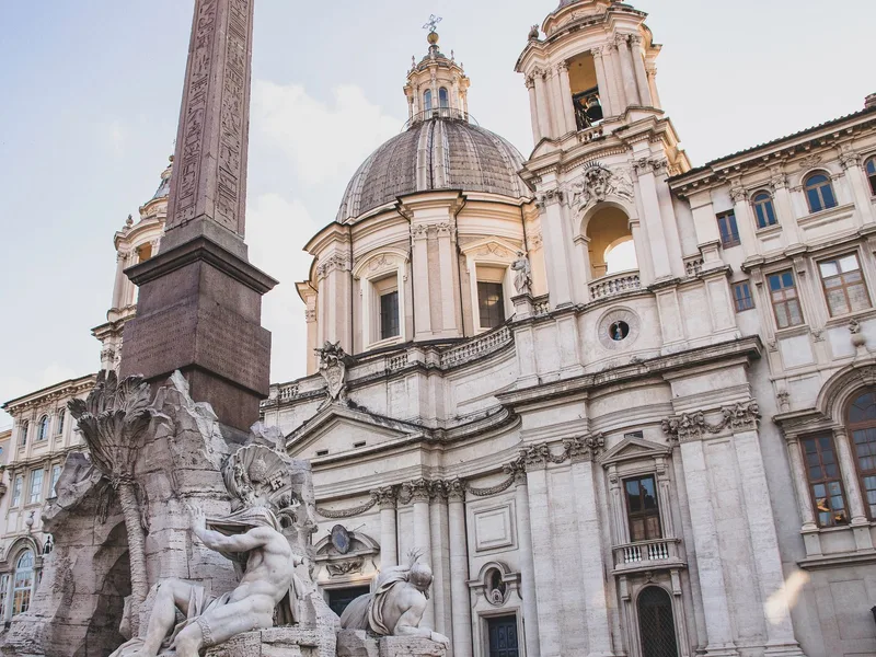 Piazza Navona at dusk with the Fountain of the Four Rivers and obelisk