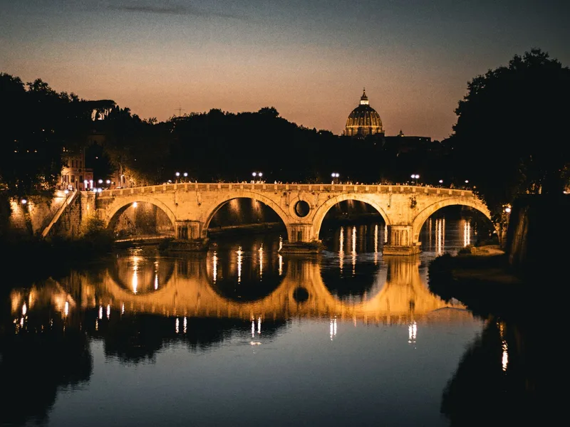 Piazza Navona illuminated at night during a Rome walking tour